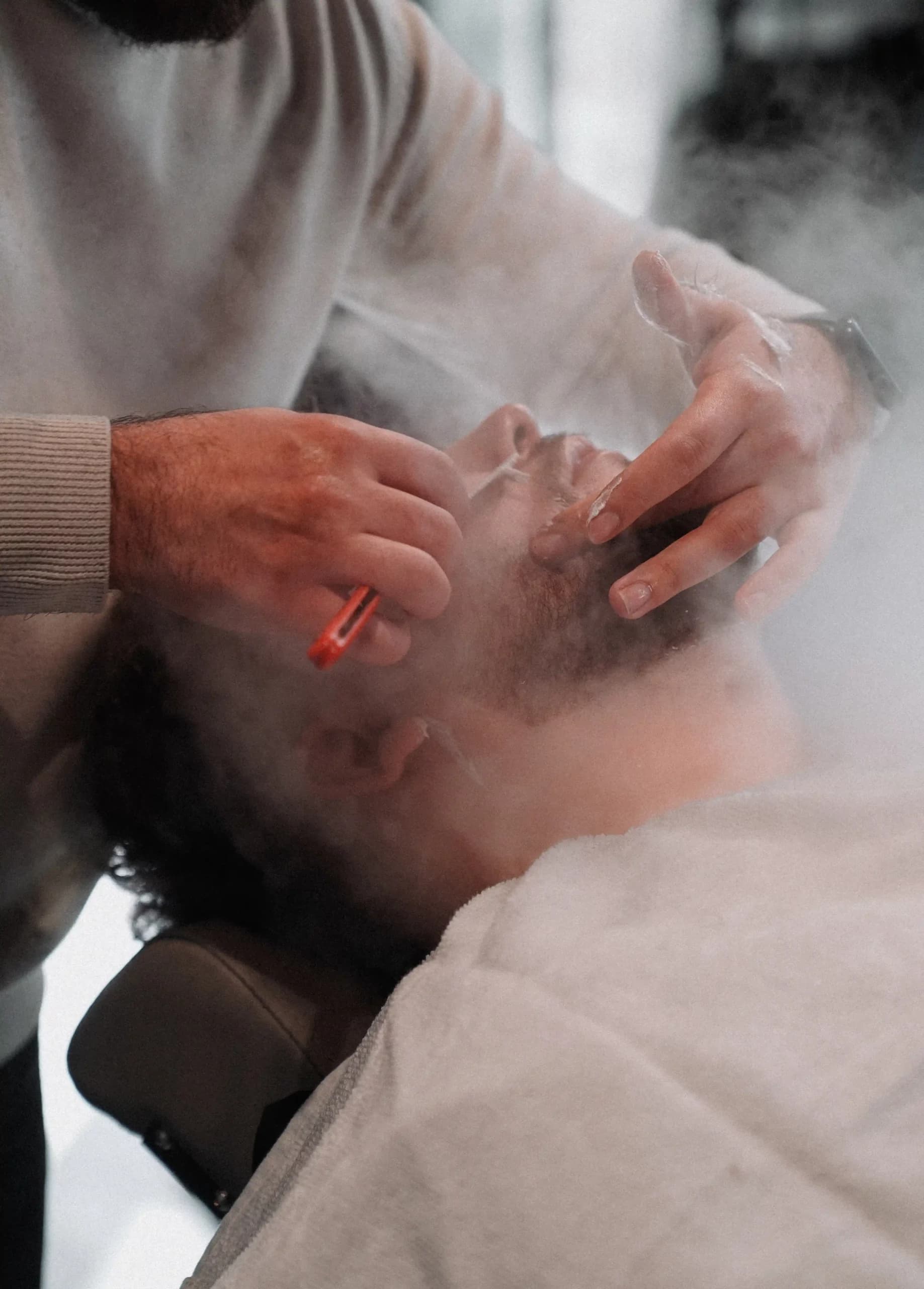 Classic straight-razor shave, the hot towel still steaming