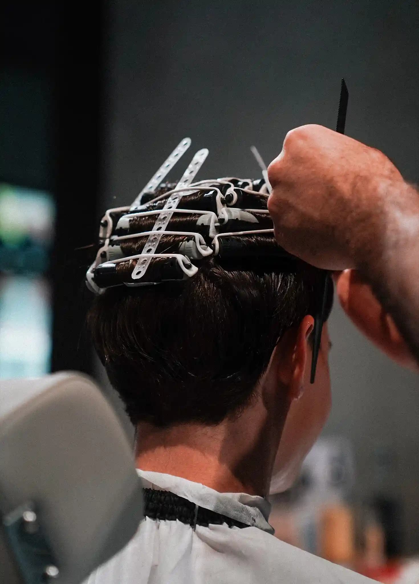 Rods wound into the hair during a perm